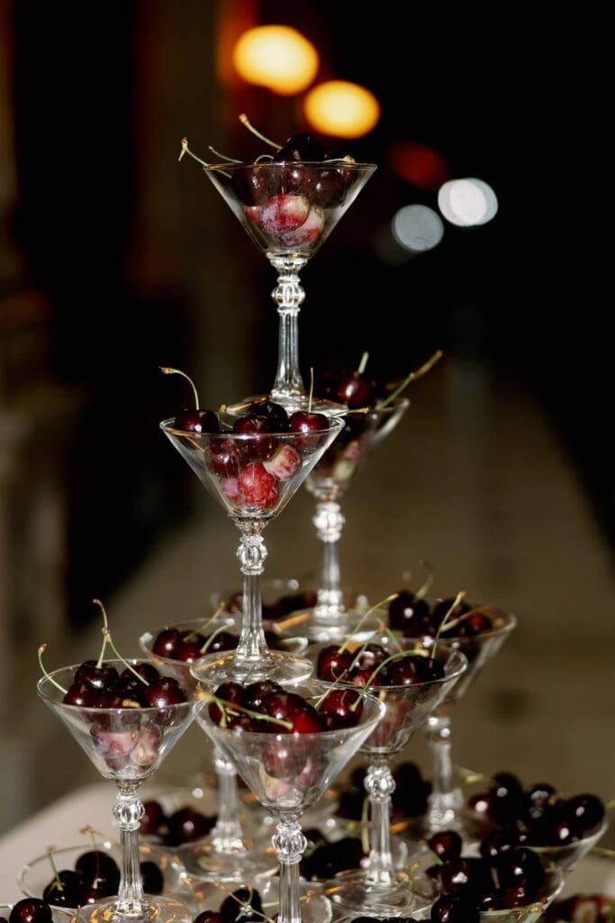 George Peabody Library wedding styled shoot with cherries on stacked champagne glasses