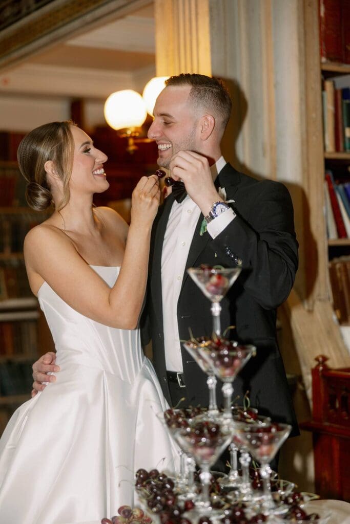 George Peabody Library wedding couple smiling and toasting