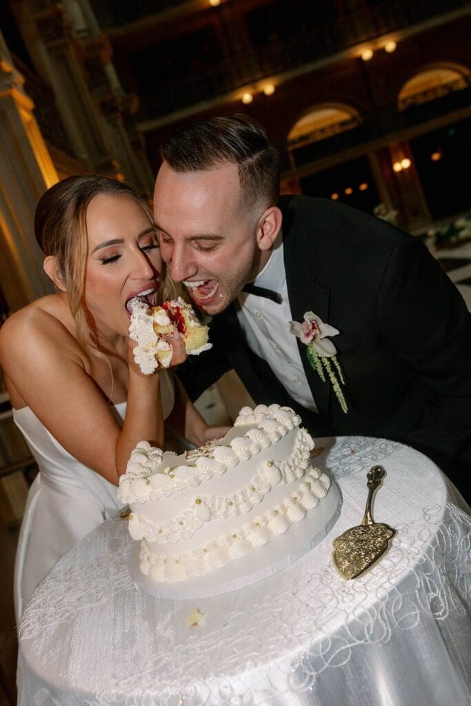George Peabody Library wedding bride and groom eating unconventional wedding cake
