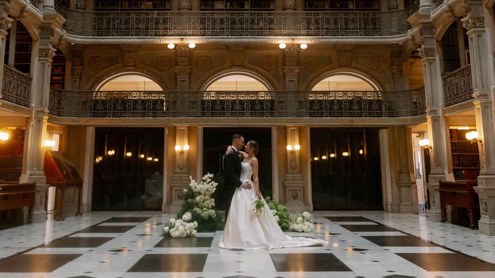 George Peabody Library Wedding in Baltimore showing bride and groom in the middle of majestic room