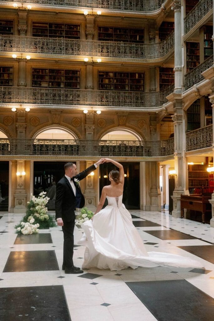 George Peabody Library wedding bride and groom in a twirl shot