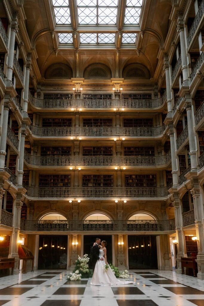 George Peabody Library Wedding with bride and groom in the middle of iconic reading room