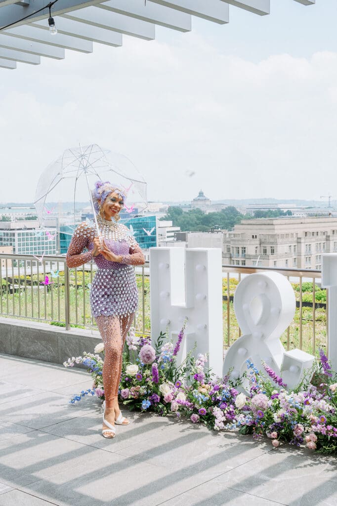Lady wearing fantasy lavender costume in a Whimsical Garden Rooftop Party In Alexandria VA