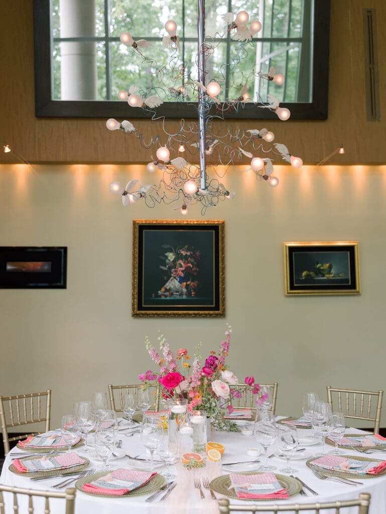 colorful florals and linens on a wedding table with calligraphy cards for a northern virginia venue