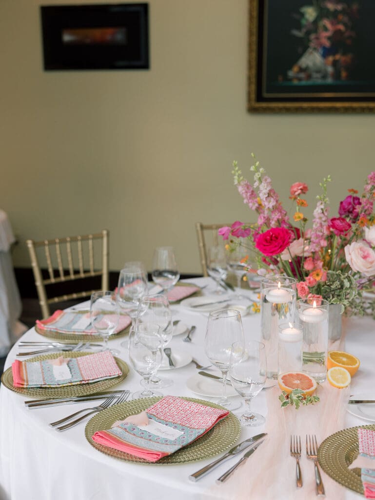 colorful table scape with hand torn calligraphy place names in virginia