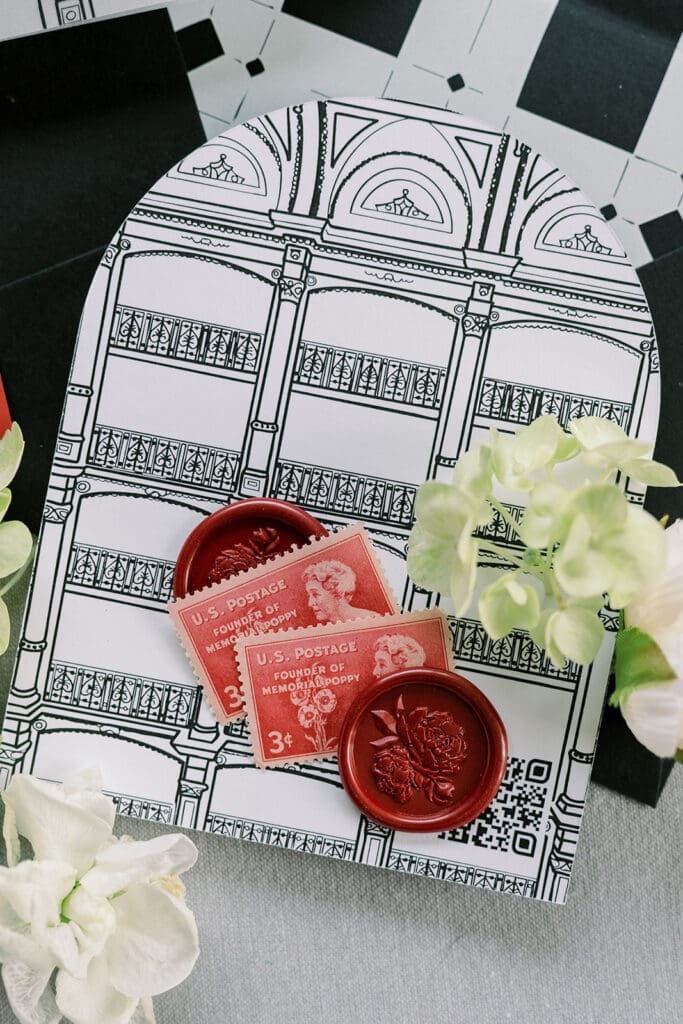 george peabody library custom venue illustration on back of invitation card with wax seals and vintage postage stamps
