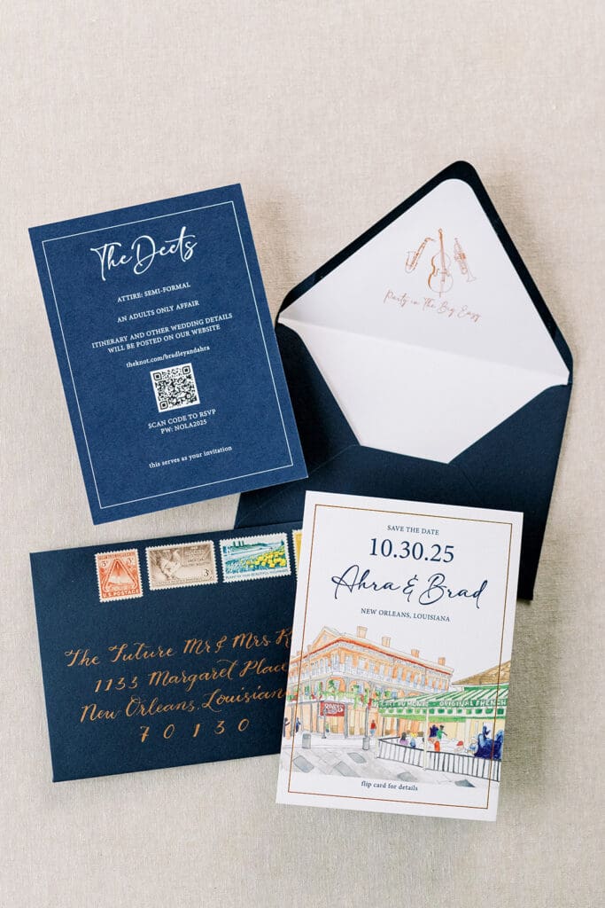 wedding save-the-dates with custom watercolor art and calligraphy on guest envelopes
