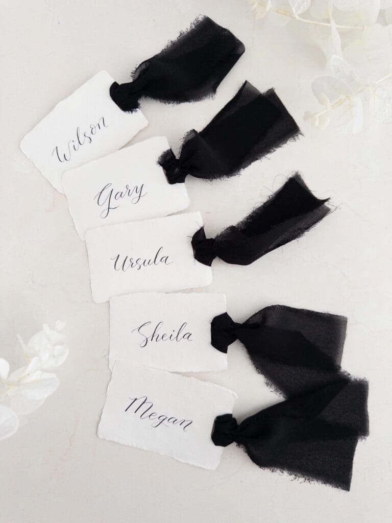 handwritten calligraphy place cards on handmade cotton paper with chiffon ribbon 