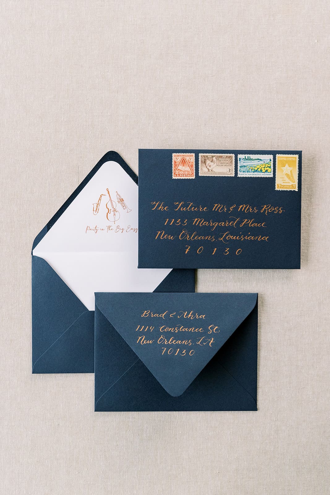 Mailing wedding invitations with calligraphy vintage stamps and custom envelope liner
